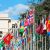 Multicolored flags in front United Nations Palais in Geneva Switzerland taken close-up.
