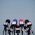 Microphones prepared for the press conference and mic flags displaying fake news logos: disinformation and propaganda concept, blank copy space
